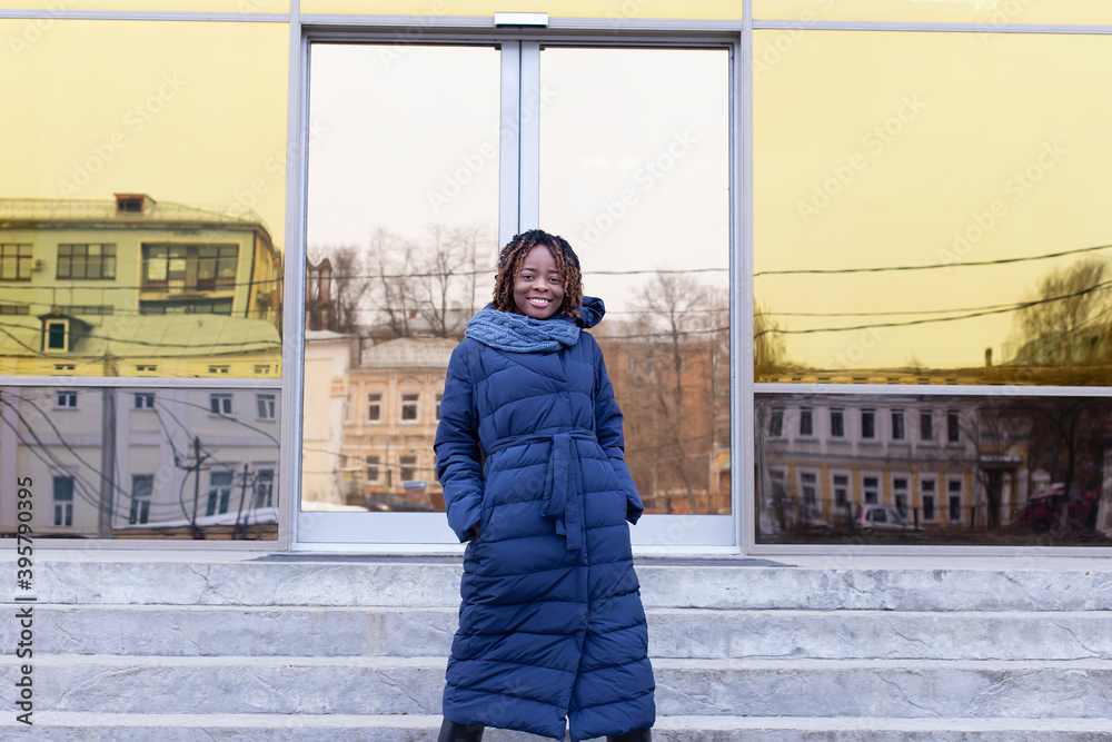 Obraz premium beautiful African American emerges from business center, in winter