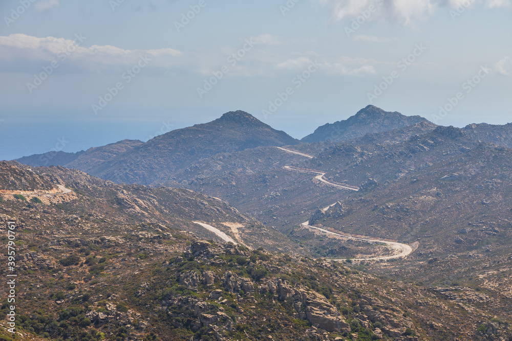 Mountain landscape, winding asphalt road, Ios Island, Greece.
