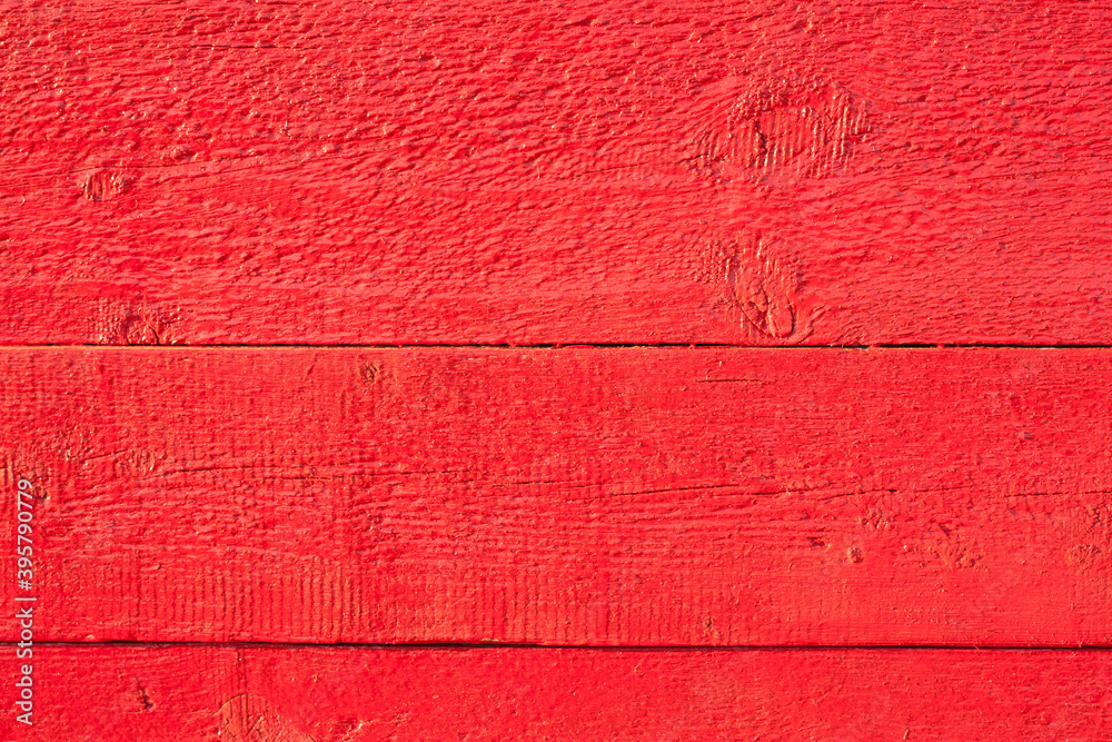 Fototapeta premium the bright red background of wooden boards