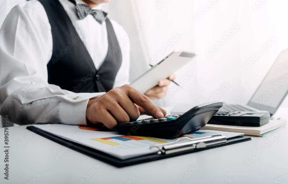 businesswoman hand using smart phone,mobile p payments online shopping,omni channel,digital tablet docking keyboard computer at office in sun light businesswoman hand using smart phone,mobile p payments online shopping,omni channel,digital tablet docking keyboard computer at office in sun light