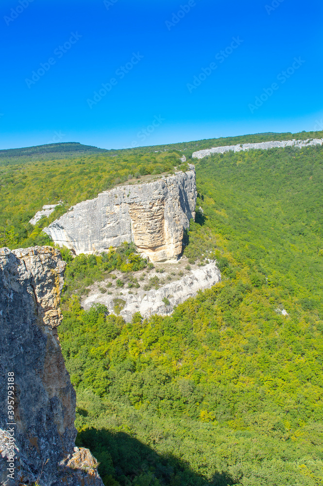 Picturesque mountain valley immersed in the greenery of the forest in Crimea near the city of Bakhchisarai 
