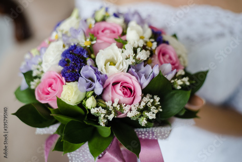 bride holding bouquet, bridal bouquet of roses