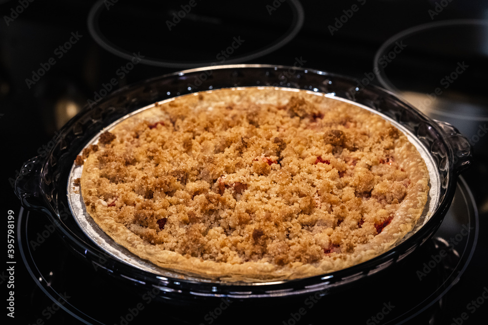 Strawberry Rhubarb Holiday Pie on a Glass Stove Top