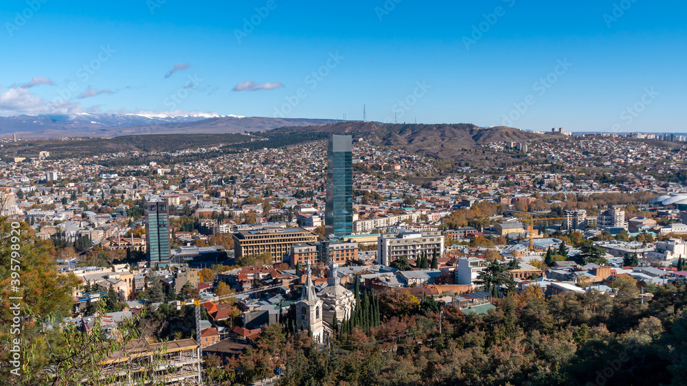 Panorama view of Tbilisi. Modern landmark - high-rise hotel Panorama view of Tbilisi. Modern landmark - high-rise hotel