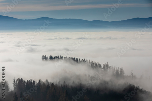 ground fog in valley, seen from mountain Pleschkogel near village Rein in Styria, Austria