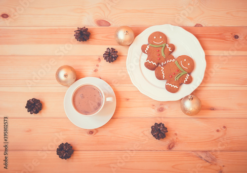 Christmas gingerbread men and cup of homemade hot chocolate.