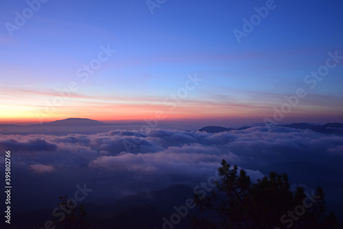 Dawning sky with sea of clouds at Phu Chee Pher viewpoint Mae Hong Son Northern Thailand.