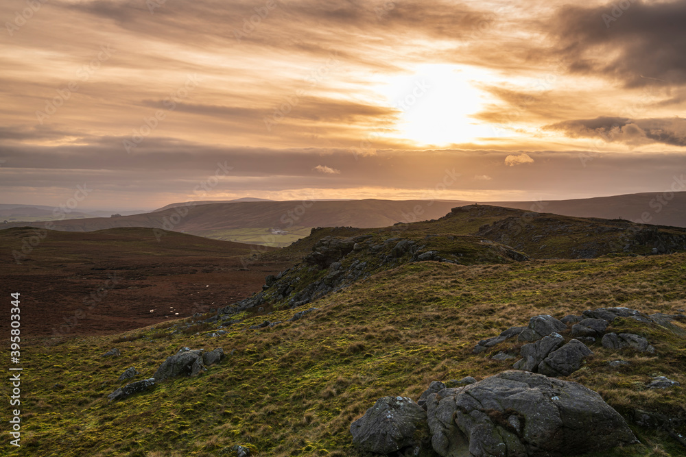 Obraz premium A blended winter sunset HDR image of Bowland Knotts in the forest of Bowland on the border between Lancashire and Yorkshire, England.