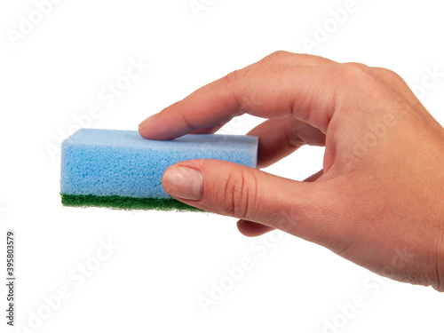 Sponge for washing dishes in hand isolated on the white
