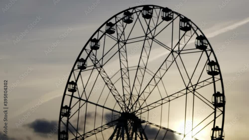 Ferris wheel against the background of the evening sky. Ferris wheel against the background of the evening sky.