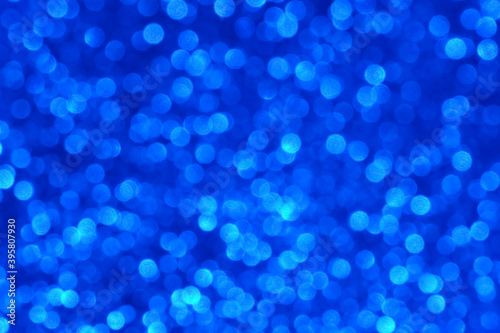 Blue glitter background with sparkling texture.
