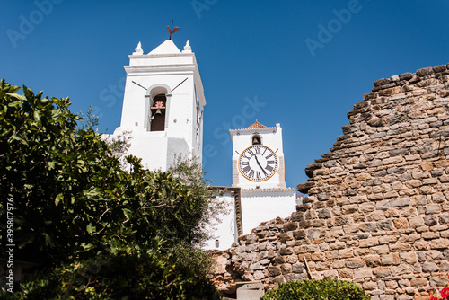 Views of the clocktower of the Igreja Santa Maria do Castelo church from the castle of Tavira in the Algarve,  Portugal © mariajuarez