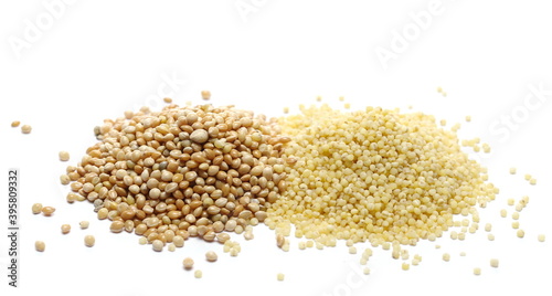 Peeled and unpeeled yellow millet seeds, organic food product isolated on white background