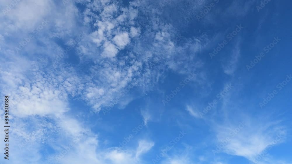 Fluffy puffy white cirrus n cirrocumulus clouds or cumulus cloudscape moving on beautiful bright sunny clear blue sky background in tropical summer sunlight n sun ray at sunny day, 4k b-roll TimeLapse Fluffy puffy white cirrus n cirrocumulus clouds or cumulus cloudscape moving on beautiful bright sunny clear blue sky background in tropical summer sunlight n sun ray at sunny day, 4k b-roll TimeLapse