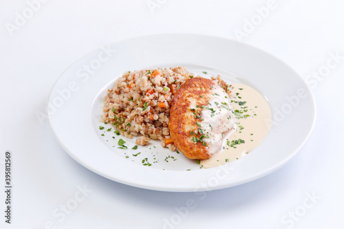 cutlet with buckwheat on the white background