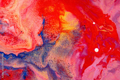 Abstract colored background of liquid mixed paints