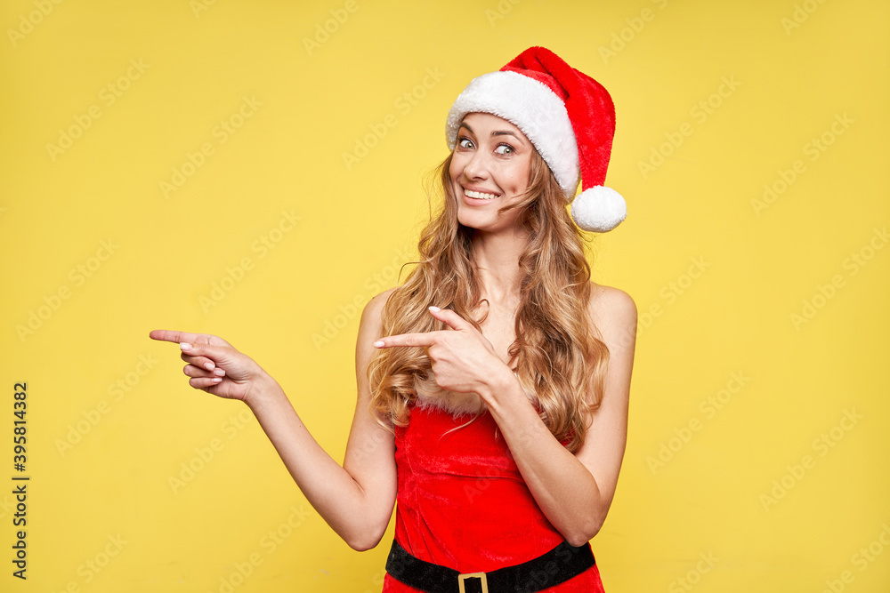 Woman christmas Santa Hat yellow studio background Woman christmas Santa Hat yellow studio background