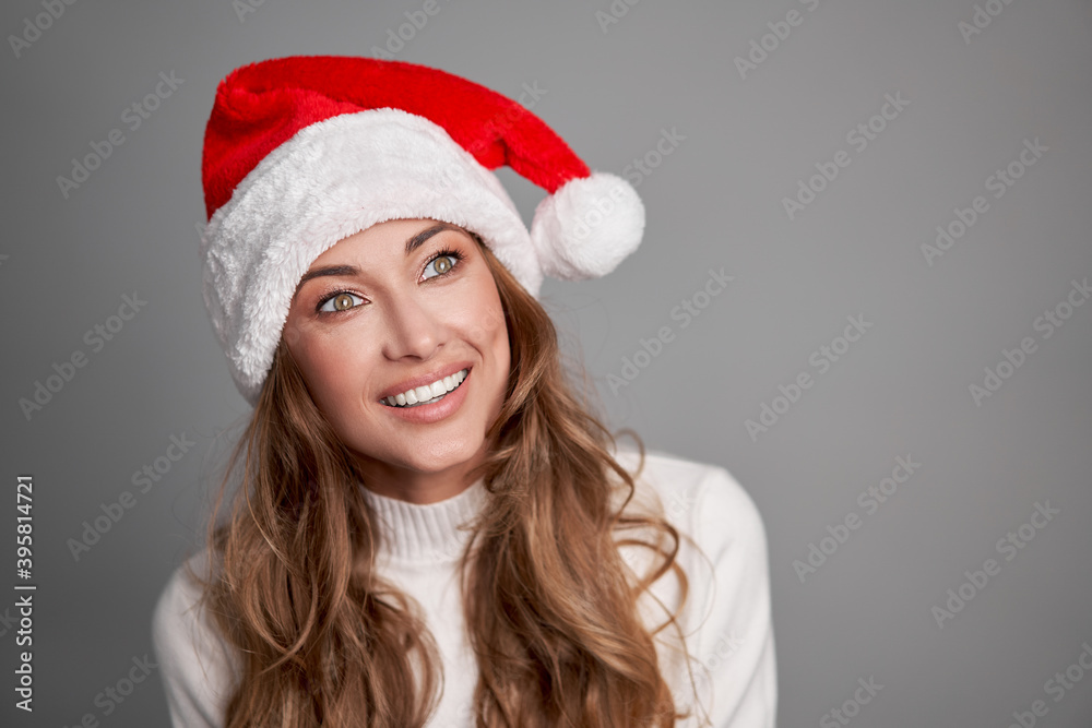 Woman christmas Santa Hat sweater white studio background Woman christmas Santa Hat sweater white studio background