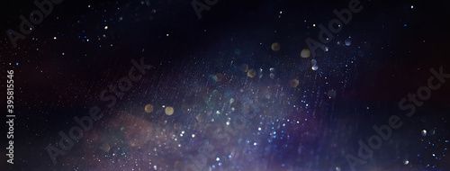 background of abstract glitter lights. Purple  silver  blue and black. de focused