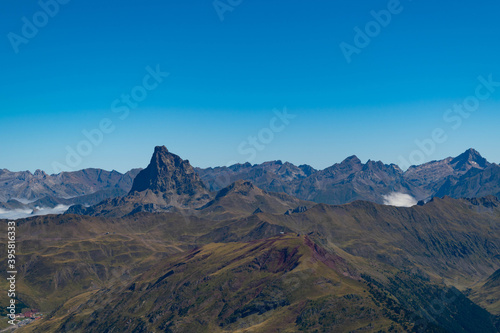 Views from the top of Aspe in the Pyrenees with mountains and peaks on the Spanish side and a sea of clouds on the French side and Midi d'Ossau in the front © Maria