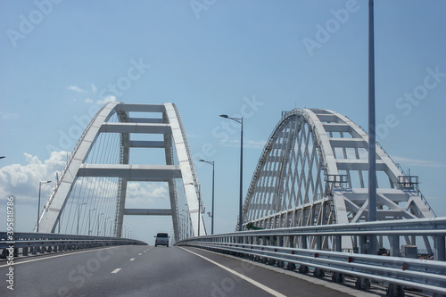 Car bridge over the river with beautiful arches