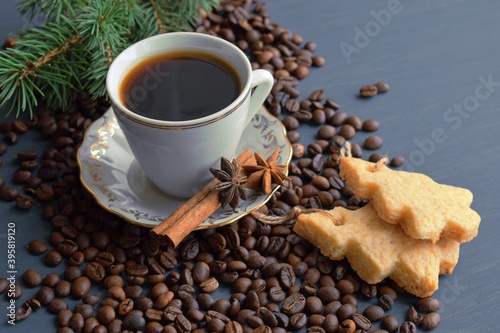 Fresh aromatic coffee and homemade cookies on a wooden background.