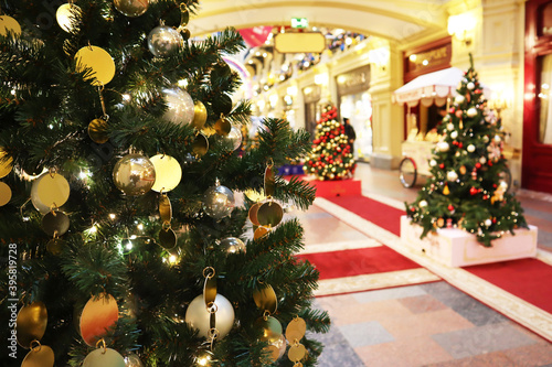 Christmas tree with new year decorations. New Year celebration. Selective soft focus. Background for postcards