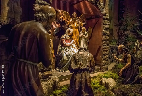 Traditional Christmas nativity scene with beautiful figures made out of wood. The birth of Jesus Christ in the manger surrounded by Joseph, Mary and shepherd. © Aron M  - Austria