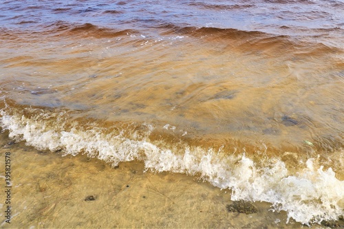 Small ocean waves splash near the coast of the Gulf of Mexico