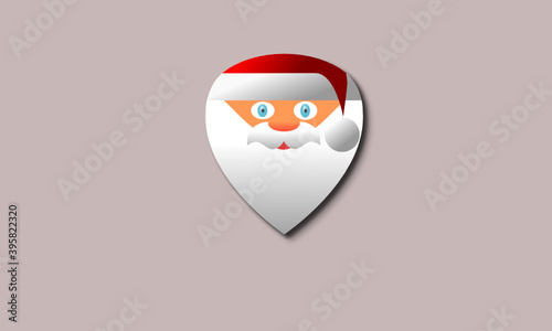 A guitar pick with a picture of Santa Claus
