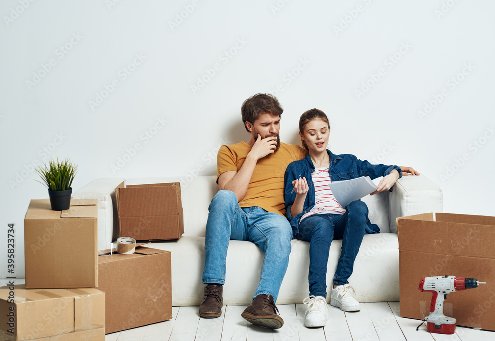 A room on a white sofa with boxes moving apartments A room on a white sofa with boxes moving apartments
