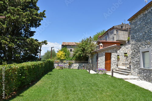 Wallpaper Mural A narrow street among the old houses of Rotonda, an old city in the Basilicata region, Italy. Torontodigital.ca