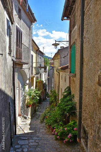Fototapeta Naklejka Na Ścianę i Meble -  A narrow street among the old houses of Rotonda, an old city in the Basilicata region, Italy.