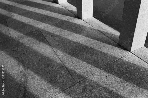 shadows of pilars on a pavement  photo