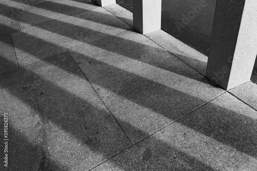 shadows of pilars on a pavement 