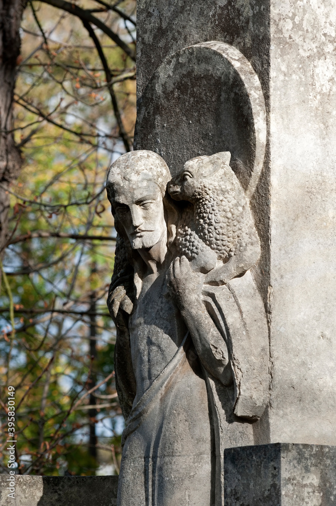 Tomb sculpture of Jesus Christ with lamb at Lychakiv cemetery in Lviv, Ukraine