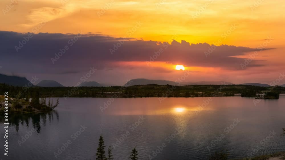 Cinemagraph Continuous Loop Animation. Beautiful View of Lewes Lake during fall season. Colorful Sunset Artistic Render. Located near Whitehorse, Carcross, Yukon, Canada. Nature Background Cinemagraph Continuous Loop Animation. Beautiful View of Lewes Lake during fall season. Colorful Sunset Artistic Render. Located near Whitehorse, Carcross, Yukon, Canada. Nature Background