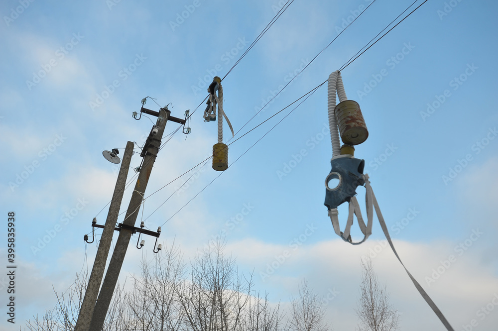 Gas masks on wires in abandoned village of Chernobyl zone Gas masks on wires in abandoned village of Chernobyl zone