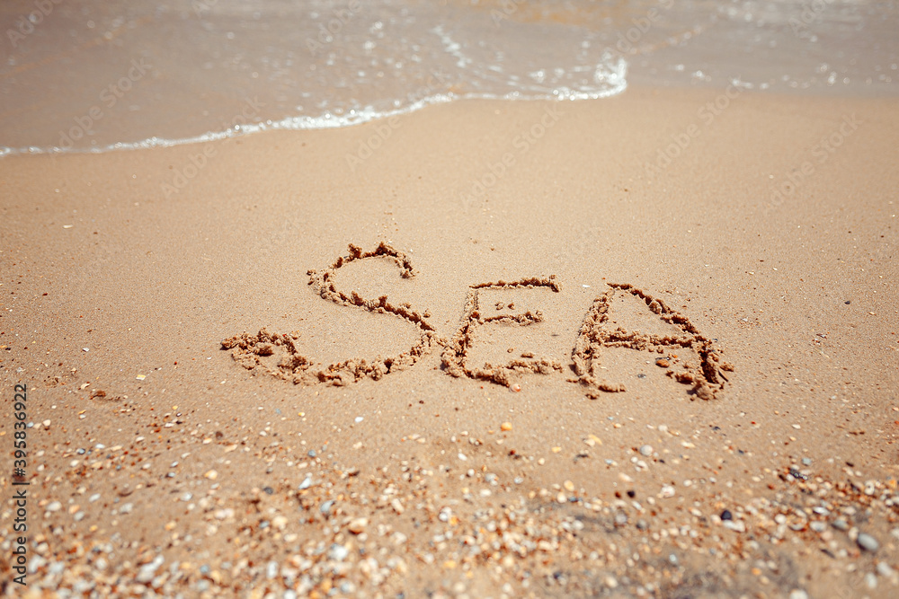 Handwritten Sea Word on the Sand Coast. Wonderful words on beach sand. Love idea concept. Handwritten Sea Word on the Sand Coast. Wonderful words on beach sand. Love idea concept.