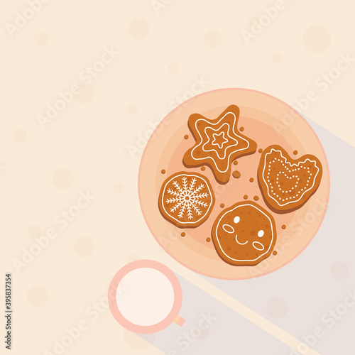 Minimalist light colored poster with a decorated gingerbread and a cup of milk. Top view of a Christmas breakfast