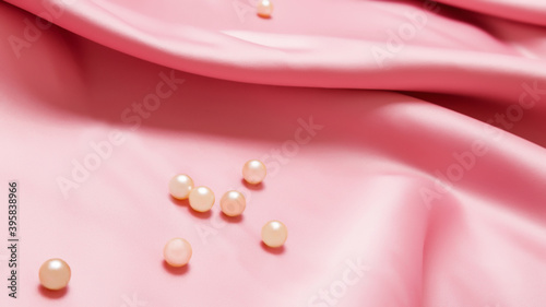 pearls on pink luxury satin fabric. Background. elegant wallpaper desing photo