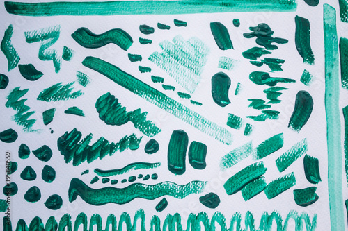 Page of green watercolour squiggles on white watercolour paper