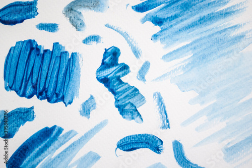 Blue watercolour squiggles on white watercolour paper
