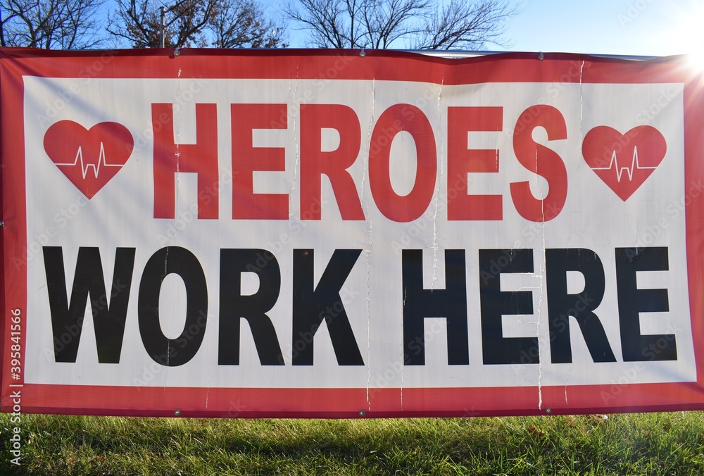 Heroes Work Here Sign Stock Photo | Adobe Stock