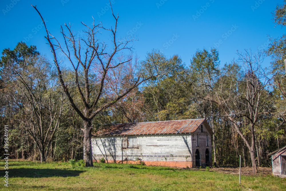 Old wooden rustic style barn in rural Georgia side corner Old wooden rustic style barn in rural Georgia side corner