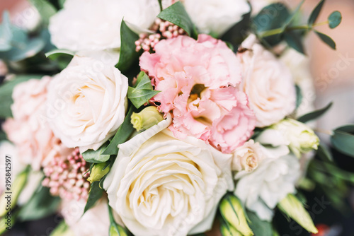 Wedding bouquet of delicate color roses close up © Илья Антохин