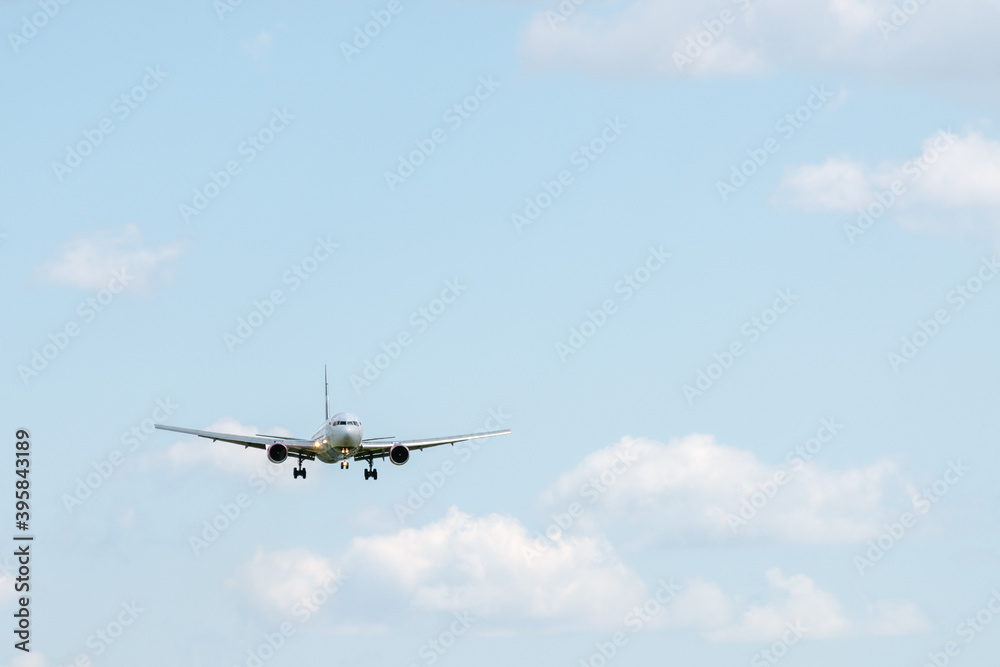 Silhouette of a plane coming in for landing against the blue sky. Silhouette of a plane coming in for landing against the blue sky.