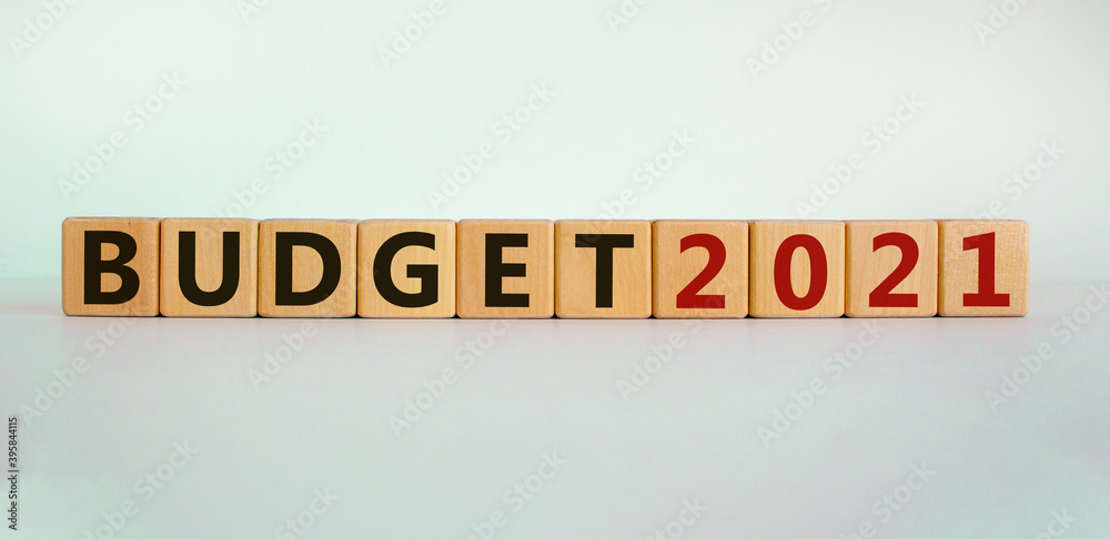 Business concept of starting 2021. Wooden cubes with word 'Budget 2021'. Beautiful white background, copy space. New year and budget 2021 concept. Business concept of starting 2021. Wooden cubes with word 'Budget 2021'. Beautiful white background, copy space. New year and budget 2021 concept.