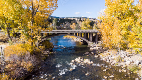 Drone point of view over the Truckee river as it passes under a bridge near Crystal Peak park in Verdi