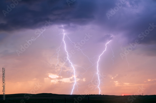 Lightning storm and dramatic sunset sky